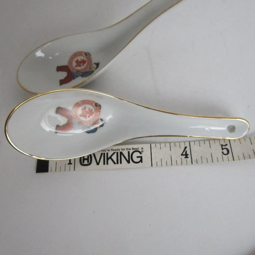pair of porcelain soup spoons